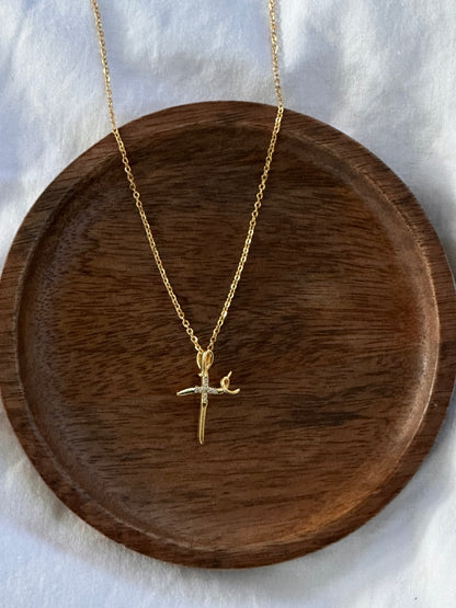 Lifestyle shot of Fé faith necklace worn as symbol of Christian heritage
