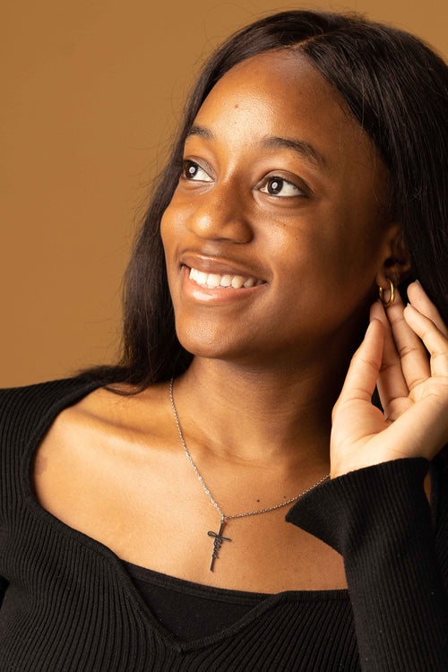 Jesus crucifix necklace in gold finish showing detailed cross pendant design