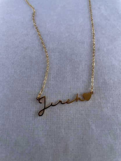 Jireh - God will provide. God the provider necklace on a flat white surface.