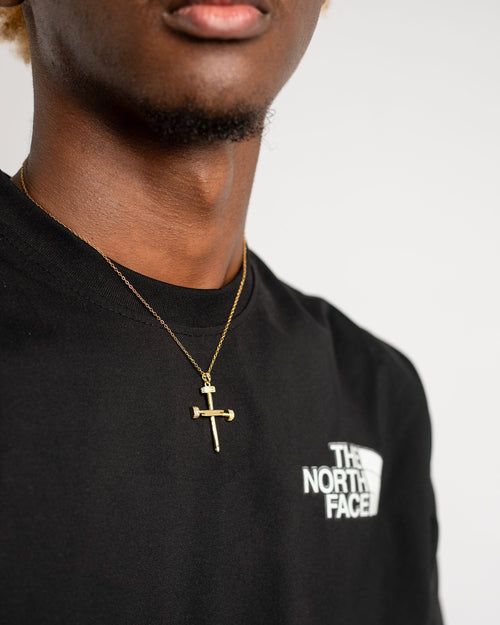 Three nails cross necklace representing Christ's crucifixion and sacrificial love