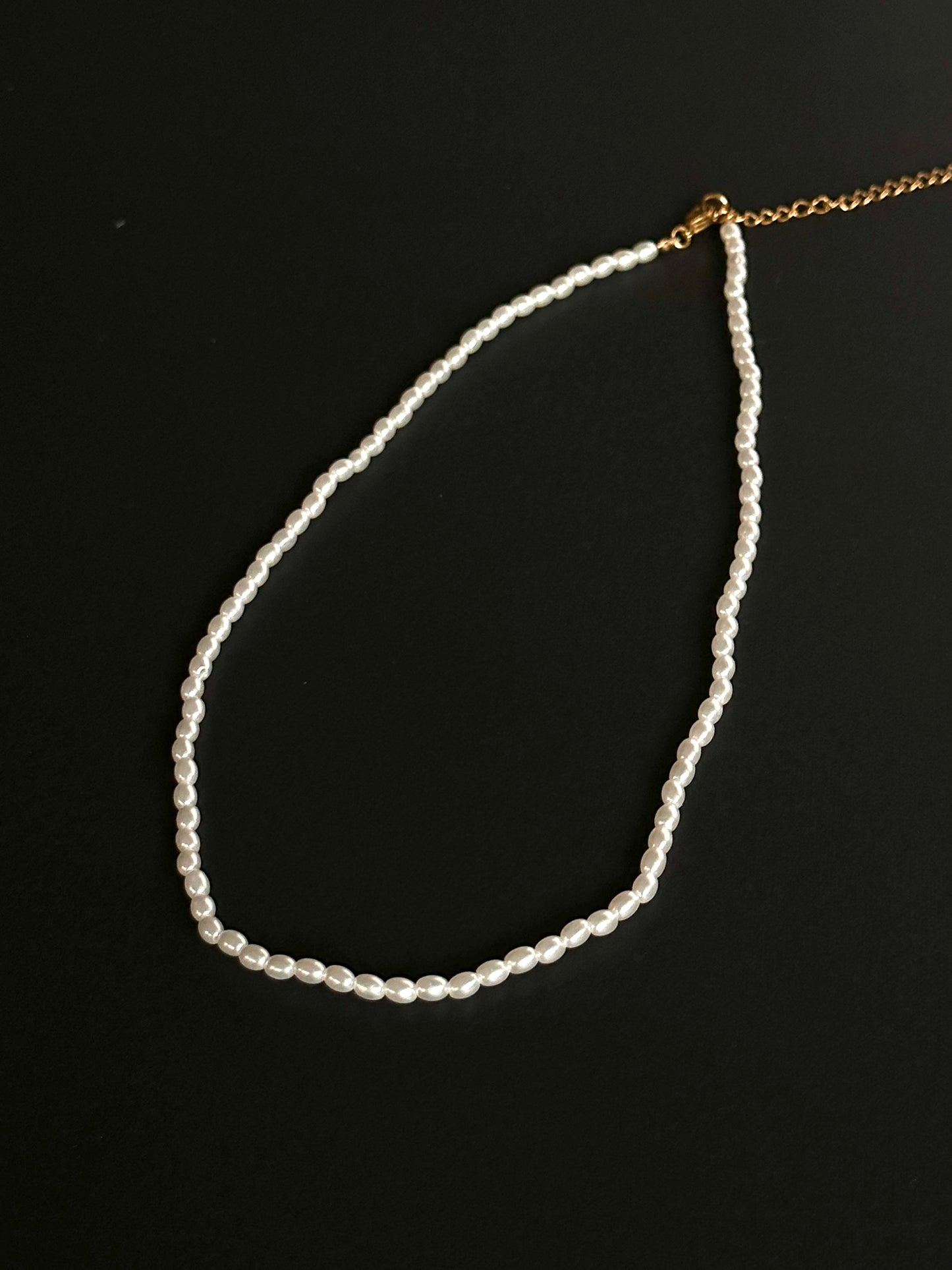 Product photo of elegant white pearls, showcasing their lustrous sheen and timeless beauty. Perfect for church services or weddings, these pearls add a touch of sophistication and grace, making them an ideal choice for special occasions