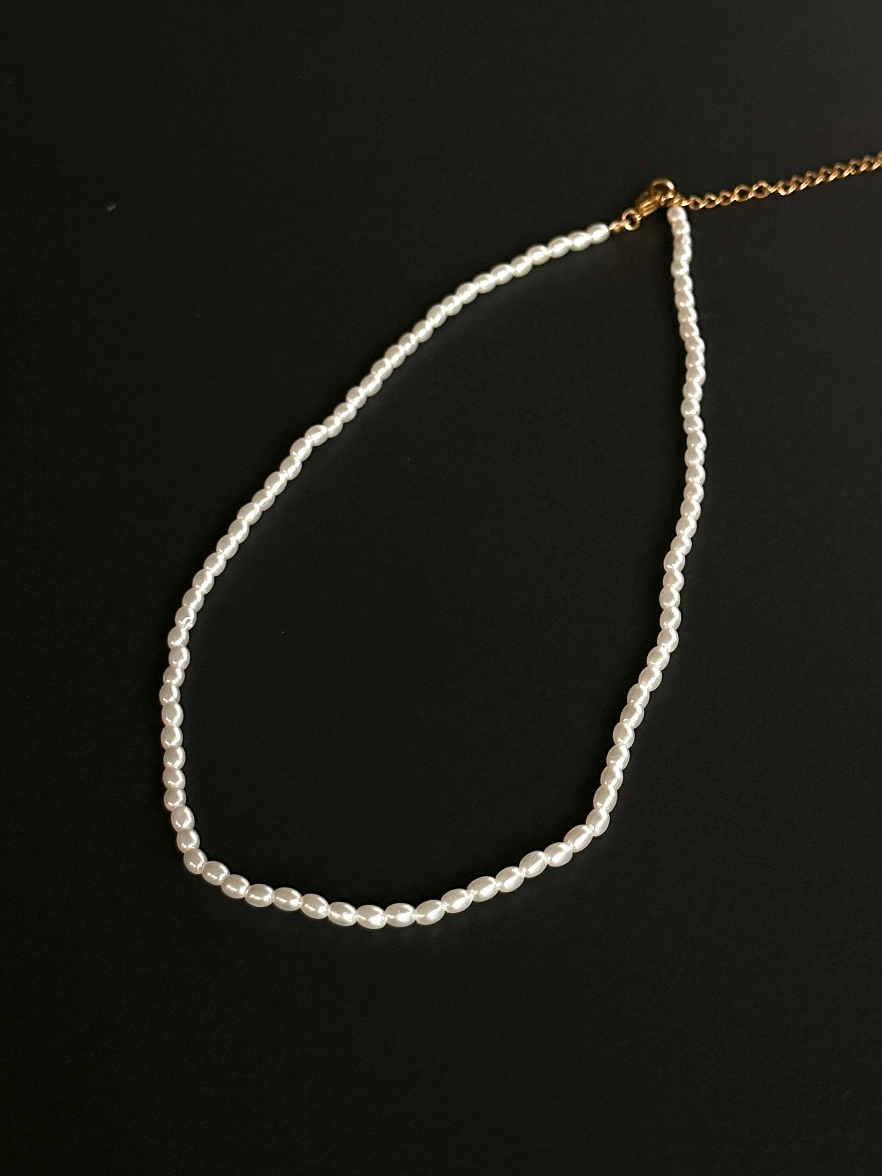 Product photo of elegant white pearls, showcasing their lustrous sheen and timeless beauty. Perfect for church services or weddings, these pearls add a touch of sophistication and grace, making them an ideal choice for special occasions