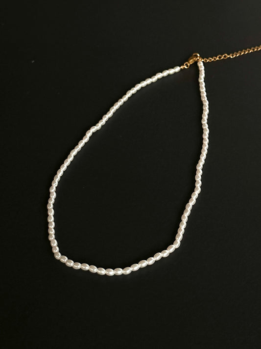 Product photo of elegant white pearls, showcasing their lustrous sheen and timeless beauty. Perfect for church services or weddings, these pearls add a touch of sophistication and grace, making them an ideal choice for special occasions