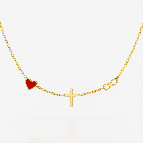 Gold necklace with a red heart, cross, and infinity symbol on a white background