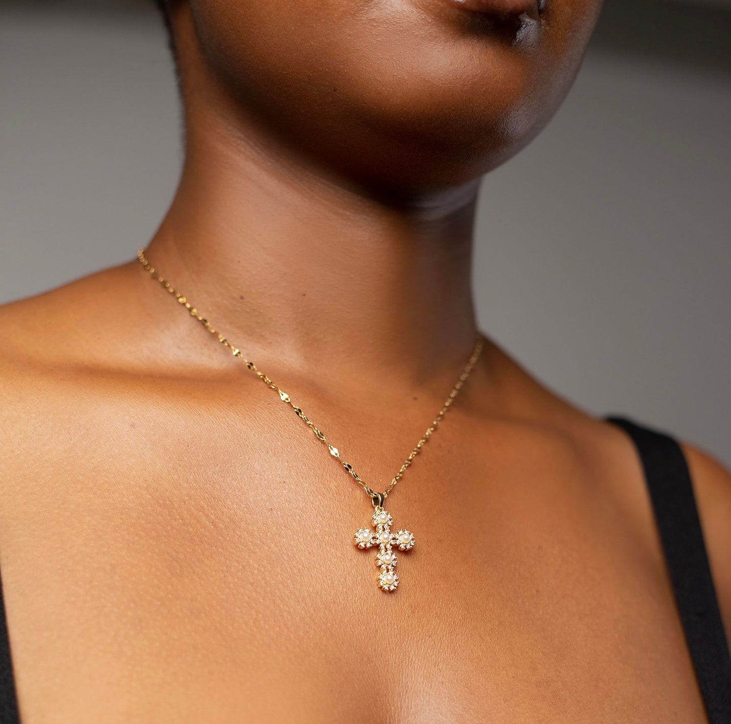 Model wearing the Bold Love Pearl Necklace, a striking unisex accessory featuring a blend of bold design and timeless elegance. Perfect for men and women who celebrate the humility and love of Christ, this necklace serves as a meaningful gift for special occasions like Easter, baptisms, or anniversaries.